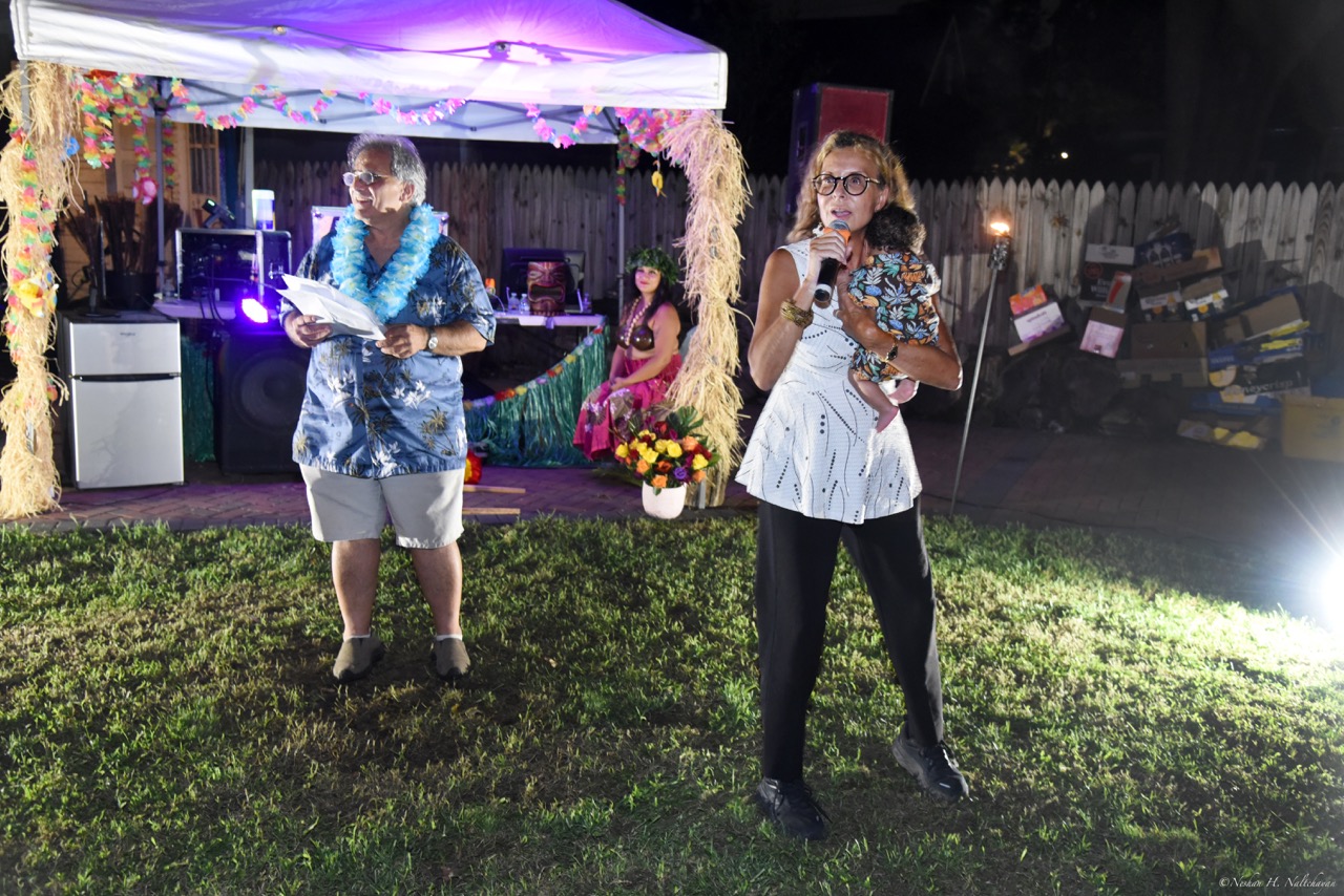 Community members gathering at the 24th Annual Michael D. Herman & Associates Luau