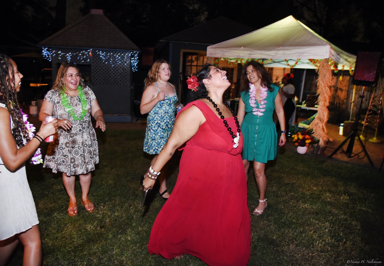Guests celebrating at the 24th Annual Michael D. Herman & Associates Luau