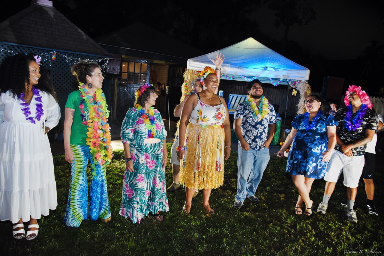 Guests celebrating at the 24th Annual Michael D. Herman & Associates Luau