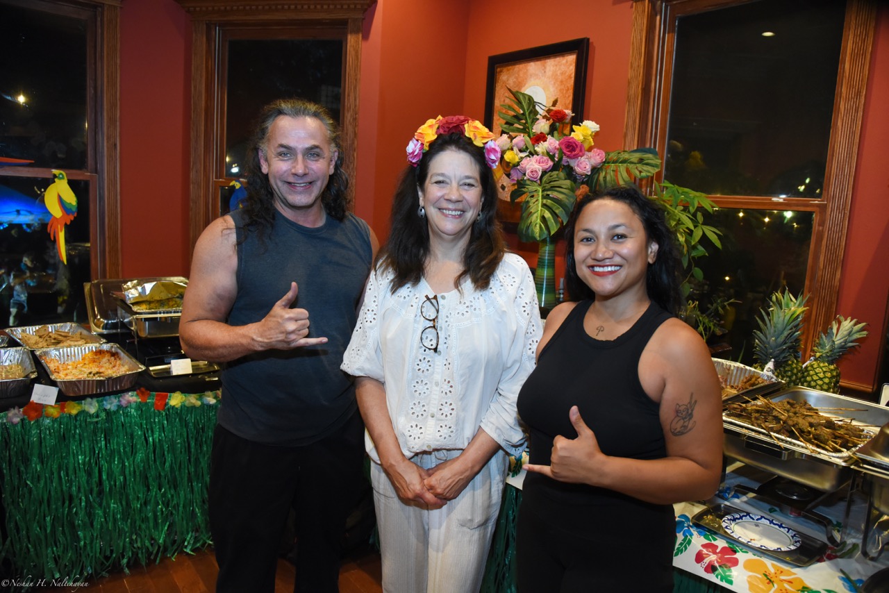 Guests celebrating at the 24th Annual Michael D. Herman & Associates Luau