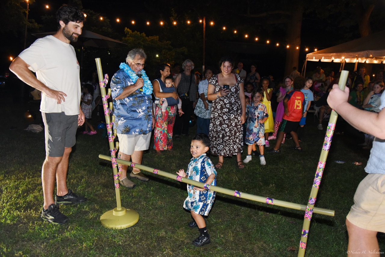 Guests celebrating at the 24th Annual Michael D. Herman & Associates Luau